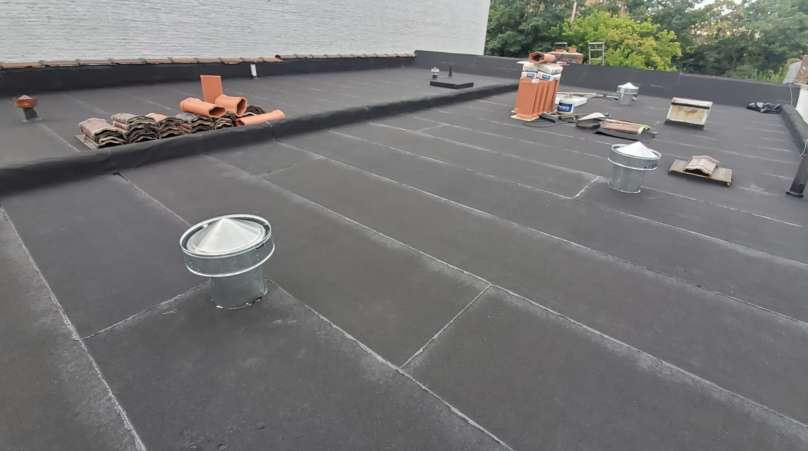 Flat Roof Installation, New Skylight, New Gutters and New Shingle Project Shot 3