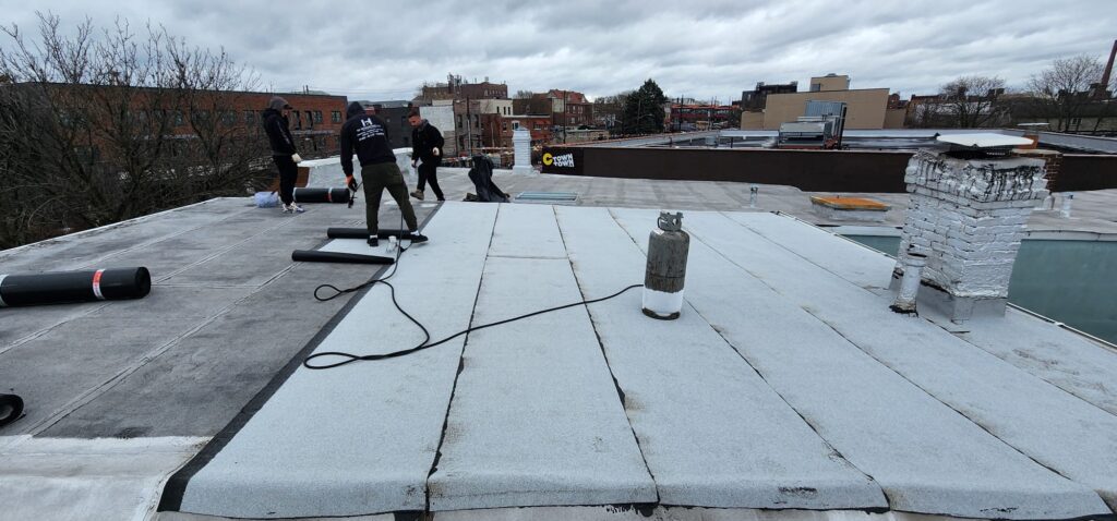 New Layer Installation Over Existing Flat Roof in Bronx Project Shot 1