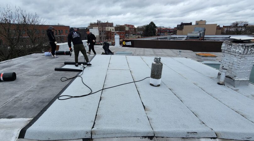 New Layer Installation Over Existing Flat Roof in Bronx Project Shot 1