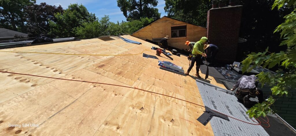 New Plywood on Shingle Flat Roof and Siding Installation Project Shot 3