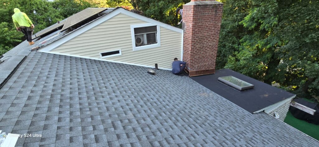 New Plywood on Shingle Flat Roof and Siding Installation Project Shot 6