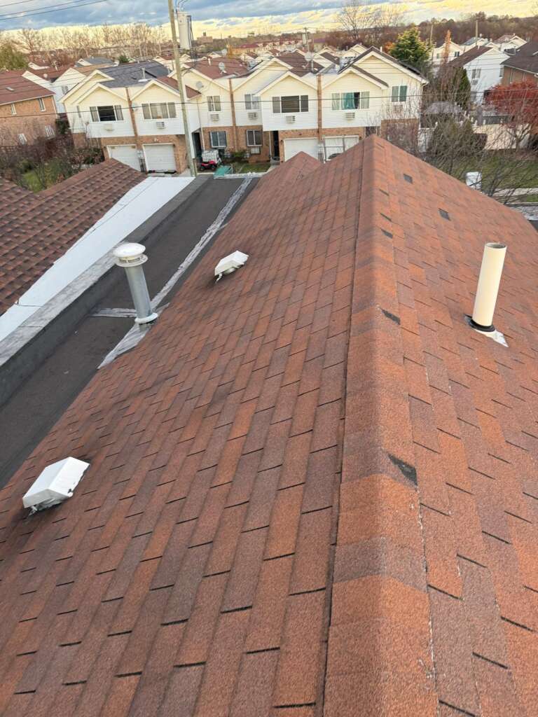 Completed new shingle roof installation at Castle Hill, Bronx (ZIP 10473). High-quality shingle roofing system installed by Home Team Construction for maximum durability and protection.
