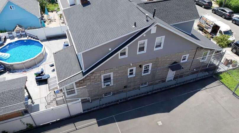 Flat Shingle Roof, Siding & Gutter Replacement in Bronx Project Shot 1