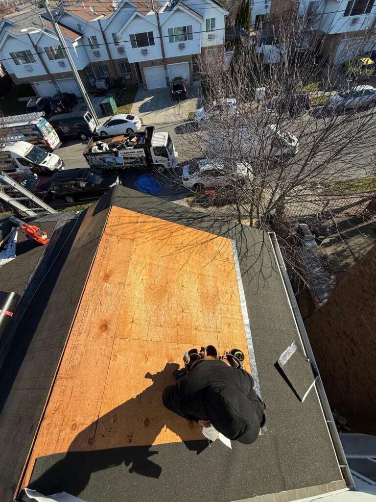 Shingle roof installation in progress at Castle Hill, Bronx (ZIP 10473). Roofing team removing old shingles, preparing roof deck, installing underlayment and ventilation for durable and long-lasting results