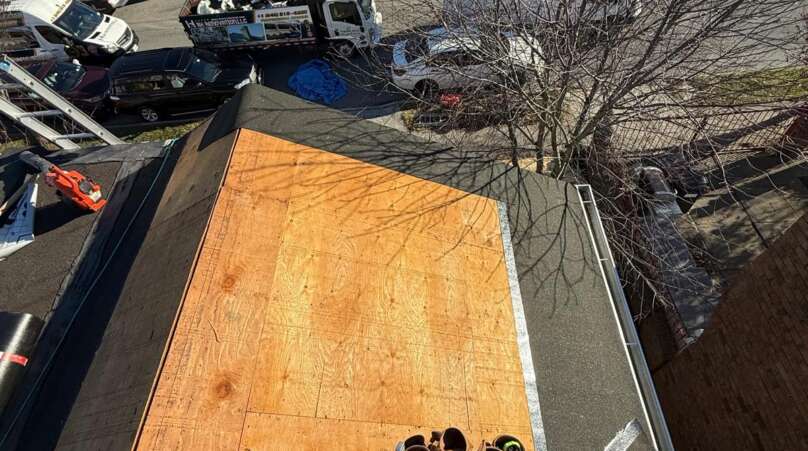 Shingle roof installation in progress at Castle Hill, Bronx (ZIP 10473). Roofing team removing old shingles, preparing roof deck, installing underlayment and ventilation for durable and long-lasting results