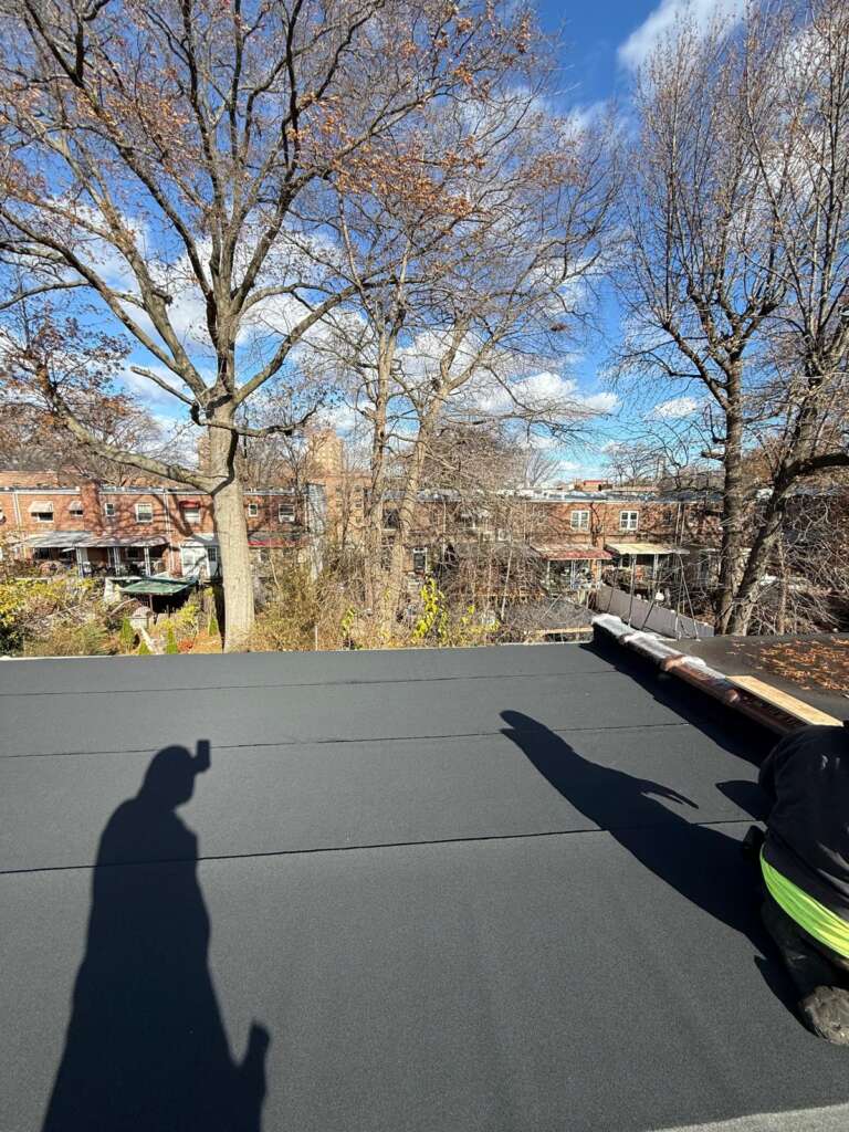 Completed flat roof replacement at Country Club, Bronx. High-quality waterproof flat roofing system installed by Home Team Construction for maximum durability and protection.