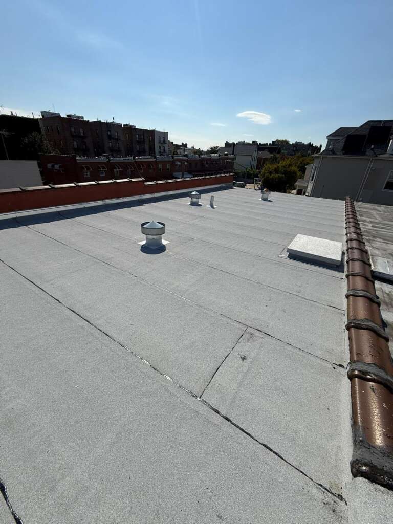 Spanish Tile Roof Replaced with New Shingle & Gutter Installation in Queens Project Shot 3
